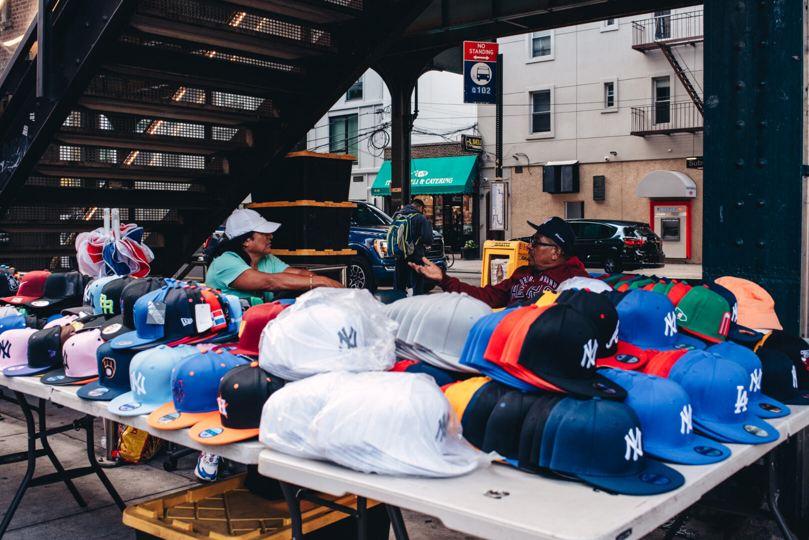 Street vendors beneath the elevated train, Queens
An informal market set up along the sidewalk.